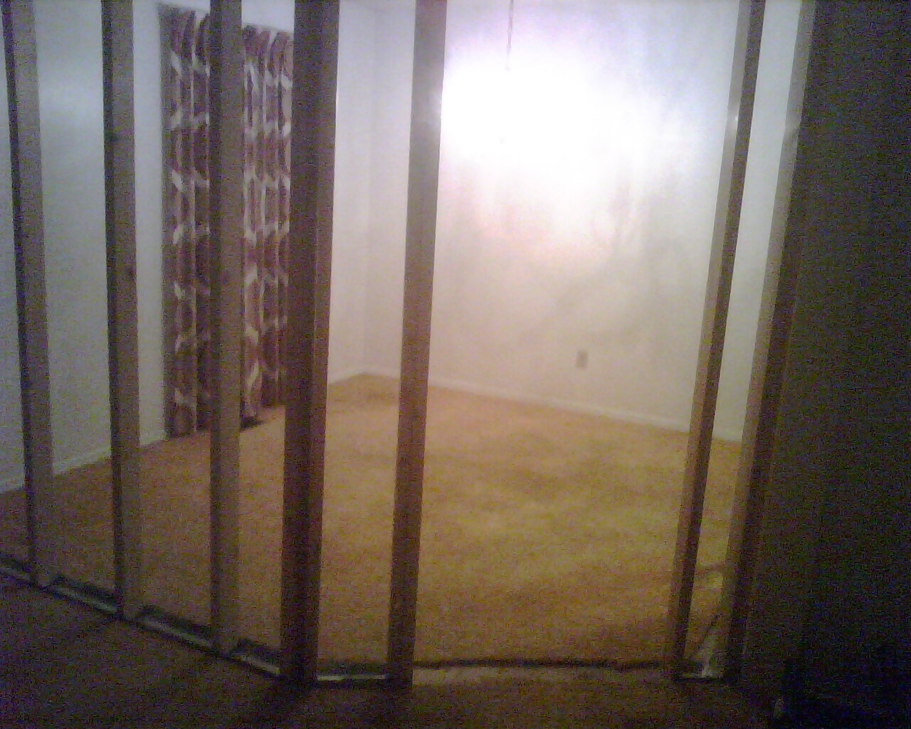This is the downstairs bedroom that is curently under construction but will be finished in about a week and either will remain carpetted or will be lamanent tiled