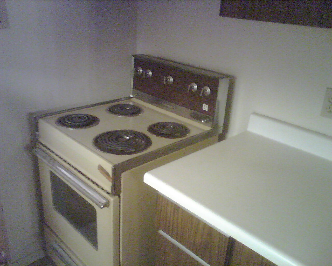 Kitchen stove as seen from near the kitchen sink