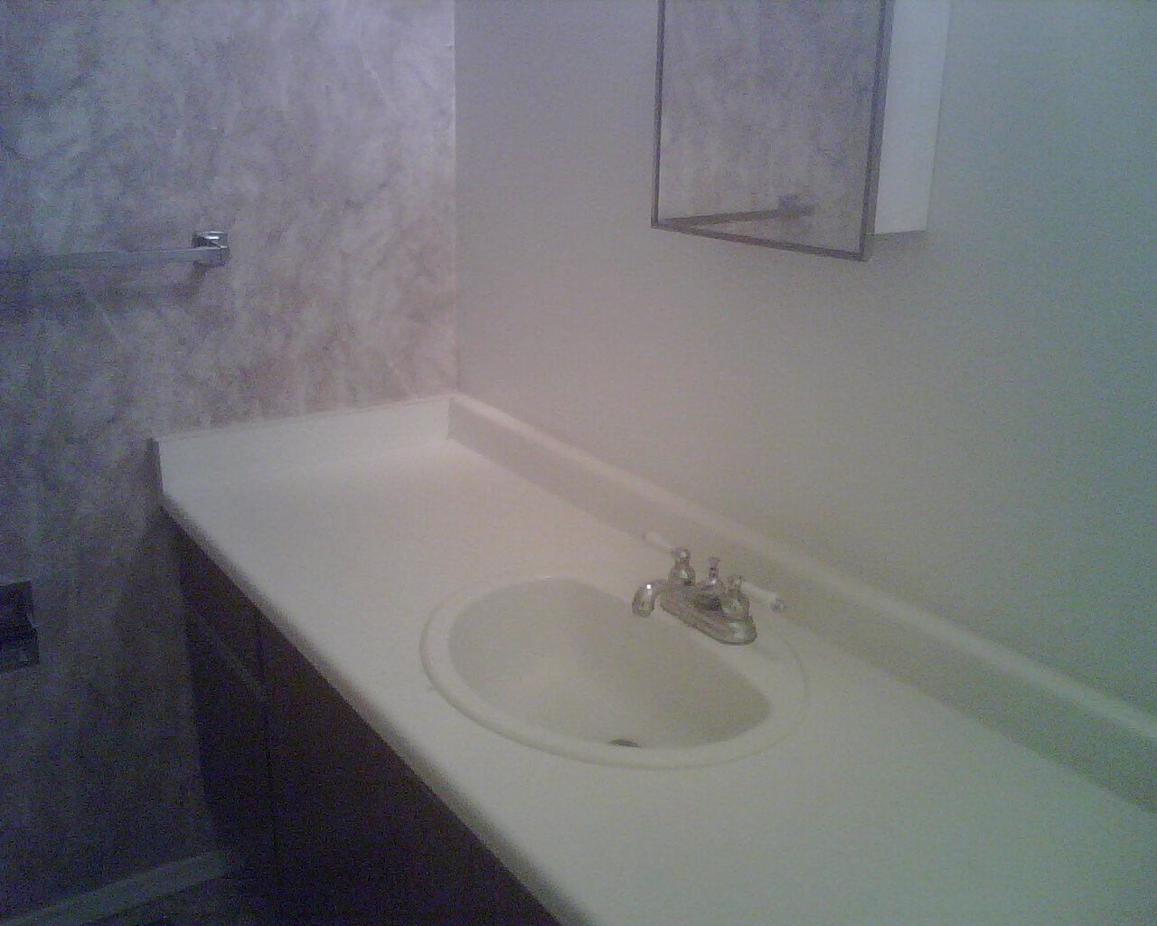 Upstairs (2nd Floor) bathroom's sink with window and closets